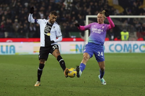 Udineses Pereyra Roberto, left, and AC Milans Simon Kjaer charge the ball during the Serie A soccer match between Udinese and Milan in Udine, Italy, Saturday, Jan. 20, 2024. (Andrea Bressanutti/LaPresse via AP)