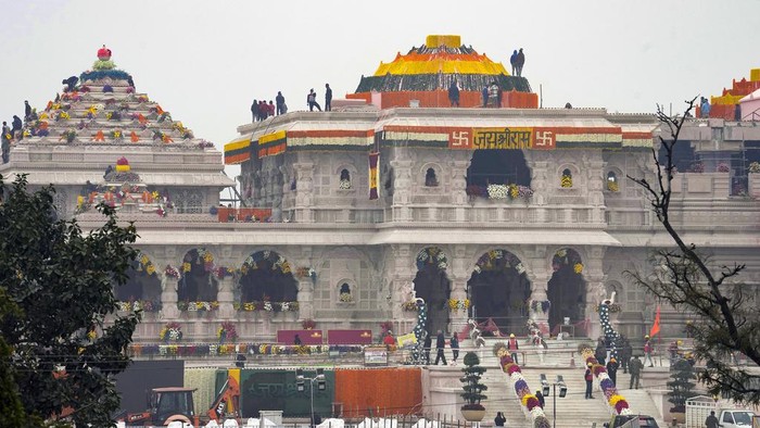 The compound and the building of a temple dedicated to Hindu deity Lord Ram are decorated with flowers the day before the temples grand opening in Ayodhya, India, Sunday, Jan. 21, 2024.  (AP Photo/Rajesh Kumar Singh)