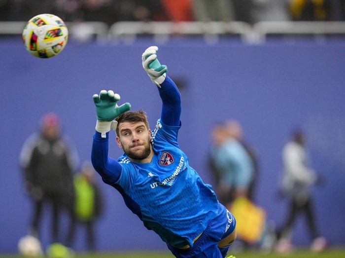 FC Dallas goalkeeper Maarten Paes dives on a shot by Inter Miami during the first half of a preseason friendly MLS soccer match Monday, Jan. 22, 2024, at the Cotton Bowl in Dallas. The shot went wide of his net. (AP Photo/Julio Cortez)