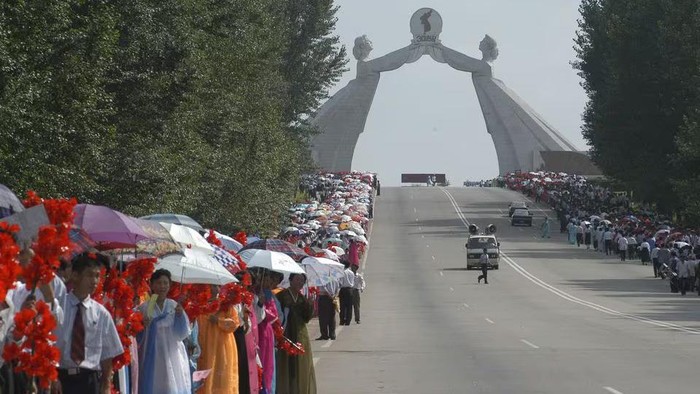 People take part in the celebrations for the National Liberation Day near the Arch of Reunification in the city of Pyongyang, North Korea August 14, 2005 Reuters/File Photo Acquire Licensing Rights, opens new tab