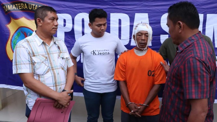 Pria yang bacok kepala sendiri usai pukul istri pakai balok. (Foto: Dok. Polres Sergai).