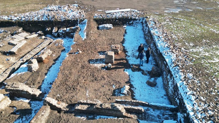 Miomir Korac, the leading archaeologist, poses next to a maquette of an ancient Roman triumphal arch, the remains of which were discovered at the site of Viminacium, a former Roman settlement near the town of Kostolac, Serbia, January 22, 2024. REUTERS/Branko Filipovic