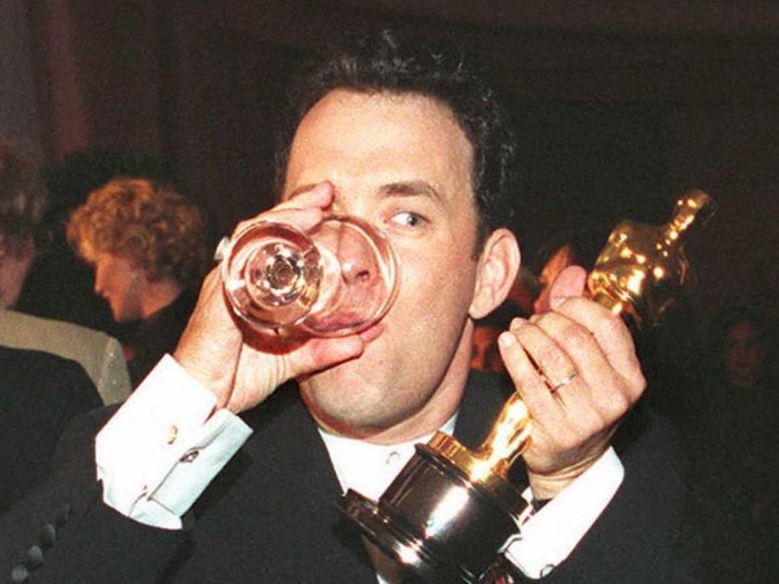 Tom Hanks US actor Tom Hanks holds up his Oscar as he drinks a glass of water while attending the Governors Ball after the 67th annual Academy Awards in Los Angeles 27 March. Hanks won as best actor for his role in the film Forrest Gump which also won five other awards, including best film and best director.
AFP PHOTO (Photo by VINCE BUCCI / AFP)