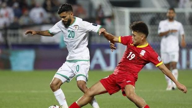 Kyrgyzstan's midfielder #19 Beknaz Almazbekov fights for the ball with Oman's midfielder #20 Salaah al-Yahyaei during the Qatar 2023 AFC Asian Cup Group F football match between Kyrgyzstan and Oman at the Abdullah bin Khalifa Stadium in Doha on January 25, 2024. (Photo by KARIM JAAFAR / AFP)