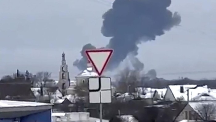 In this photo taken from validated UGC video a warplane flies before a crash at a residential area near Yablonovo, Belgorod region, Wednesday, Jun. 23, 2024. Russia says a military transport plane that was carrying 65 Ukrainian prisoners of war has crashed in a Russian region near Ukraine. (Validated UGC video via AP)