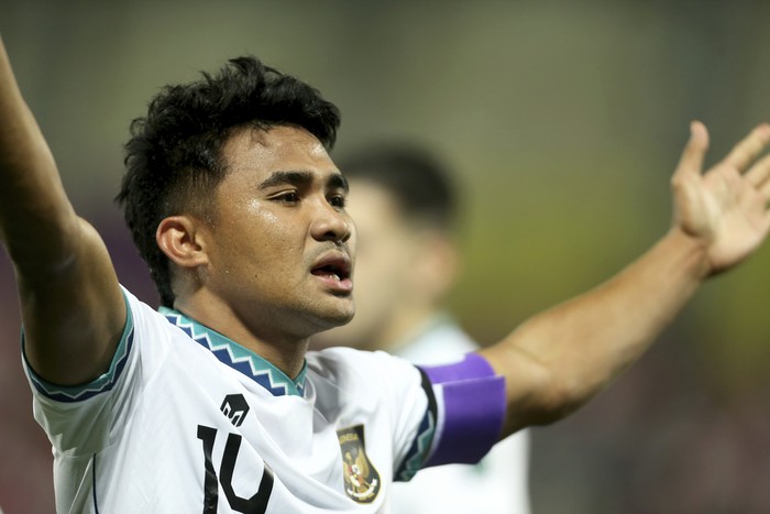 Indonesias Asnawi Mangkualam Bahar celebrates after scoring the opening goal from the penalty spot during the Asian Cup Group D soccer match between Vietnam and Indonesia at Abdullah Bin Khalifa Stadium in Doha, Qatar, Friday, Jan. 19, 2024. (AP Photo/Hussein Sayed)