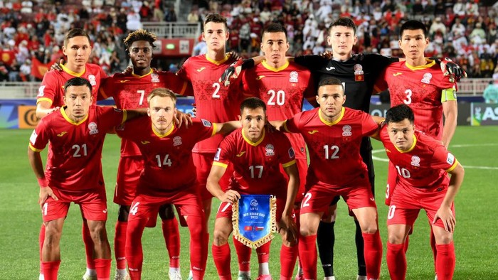 DOHA, QATAR - JANUARY 25: Players of Kyrgyzstan pose for a team photograph prior to the AFC Asian Cup Group F match between Kyrgyzstan and Oman at Abdullah Bin Khalifa Stadium on January 25, 2024 in Doha, Qatar. (Photo by Adam Nurkiewicz/Getty Images)