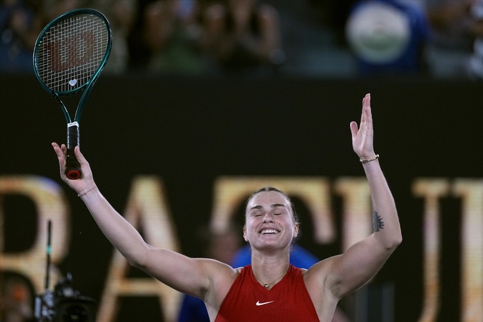 Aryna Sabalenka of Belarus celebrates after defeating Zheng Qinwen of China in the womens singles final at the Australian Open tennis championships at Melbourne Park, Melbourne, Australia, Saturday, Jan. 27, 2024. (AP Photo/Alessandra Tarantino)