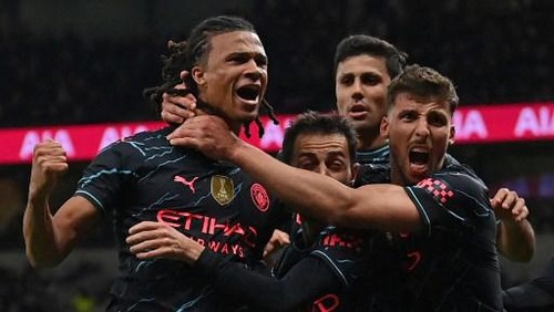 Manchester Citys Dutch defender #06 Nathan Ake (L) celebrates with teammates after scoring the opening goal of the English FA Cup fourth round football match between Tottenham Hotspur and Manchester City at Tottenham Hotspur Stadium in London, on January 26, 2024. (Photo by Glyn KIRK / AFP) / RESTRICTED TO EDITORIAL USE. No use with unauthorized audio, video, data, fixture lists, club/league logos or live services. Online in-match use limited to 120 images. An additional 40 images may be used in extra time. No video emulation. Social media in-match use limited to 120 images. An additional 40 images may be used in extra time. No use in betting publications, games or single club/league/player publications. /