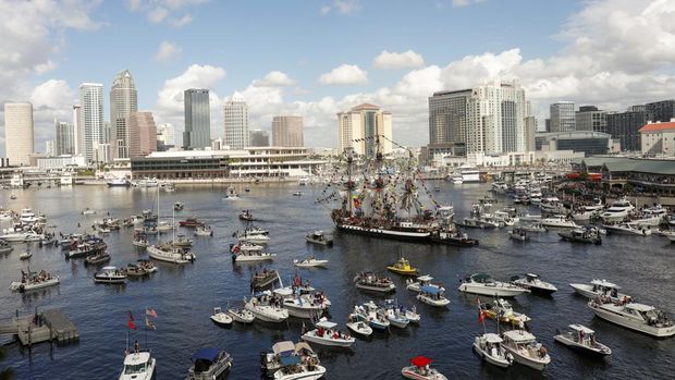 Some of the hundreds of boats that packed into the channel to watch the Gasparilla invasion and parade on Saturday, Jan. 27, 2024, in Tampa. (Luis Santana/Tampa Bay Times via AP)