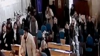 Rekaman CCTV dari dalam gereja, yang telah diverifikasi oleh Reuters, menunjukkan orang-orang bersenjata yang mengenakan penutup wajah memasuki gedung gereja dan menembak seorang pria yang berjalan di depan mereka. CCTV/Reuters.