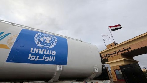 A truck, marked with United Nations Relief and Works Agency (UNRWA) logo, crosses into Egypt from Gaza, at the Rafah border crossing between Egypt and the Gaza Strip, during a temporary truce between Hamas and Israel, in Rafah, Egypt, November 27, 2023. REUTERS/Amr Abdallah Dalsh/File Photo Acquire Licensing Rights