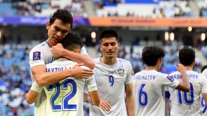 AL WAKRAH, QATAR - JANUARY 30: Abbosbek Fayzullaev of  Uzbekistan celebrates scoring their second goal with team mates during the AFC Asian Cup Round of 16 match between Uzbekistan and Thailand at Al Janoub Stadium on January 30, 2024 in Al Wakrah, Qatar. (Photo by Adam Nurkiewicz/Getty Images)