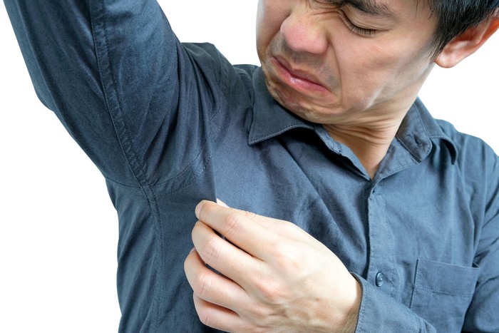 Men wear white sleeves, arms are covered with armpits, Sweat are unclean and unclean. Health care concept
