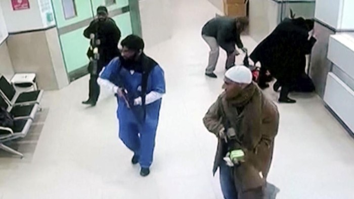 In this image taken from surveillance video provided by the Palestinian Health Ministry, Israeli forces disguised as civilian women and medical workers hold weapons in a hallway at the Ibn Sina Hospital in the West Bank town of Jenin, Tuesday, jan 30, 2024, in the occupied West Bank, killing three Palestinian militants in a dramatic raid that underscored how deadly violence has spilled into the territory from the war in Gaza. (Palestinian Health Ministry via AP)