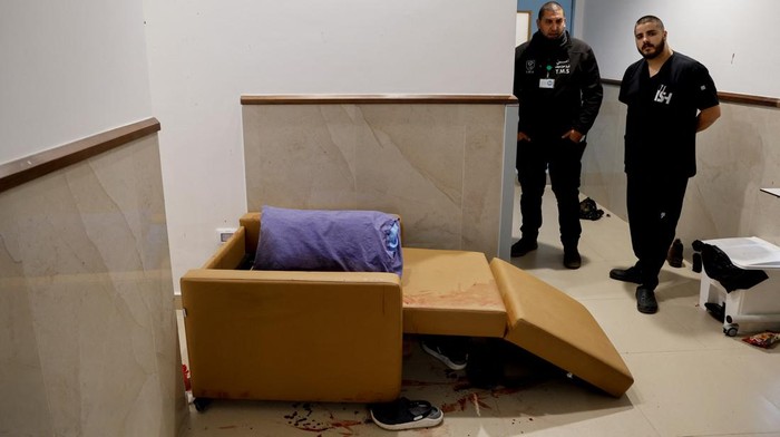 SENSITIVE MATERIAL. THIS IMAGE MAY OFFEND OR DISTURB A blood-stained pillow lies on a bed at the site where three Palestinians were killed during an Israeli raid, at a hospital in Jenin, in the Israeli-occupied West Bank, January 30, 2024. REUTERS/Raneen Sawafta