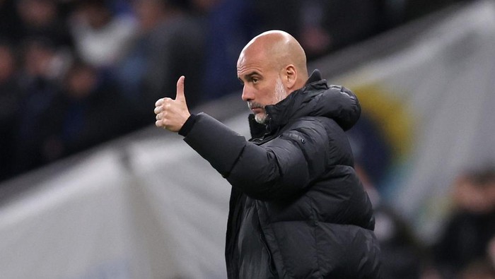 Soccer Football -  FA Cup - Fourth Round - Tottenham Hotspur v Manchester City - Tottenham Hotspur Stadium, London, Britain - January 26, 2024  Manchester City manager Pep Guardiola reacts REUTERS/David Klein