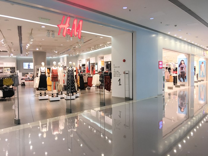 Guangzhou, China - May 10, 2016: One HM Store and  one Uniqlo Store in Guangzhou seen from the outside in Zhujiang new town(downtown Guangzhou).Uniqlo is a Japanese maker, and  HM is a Sweden one of mostly casual clothing.