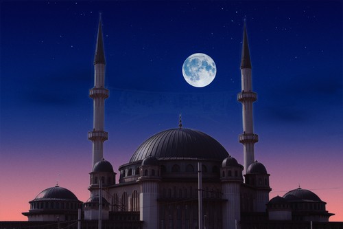 A full moon is seen over a taksim mosque in istanbul.