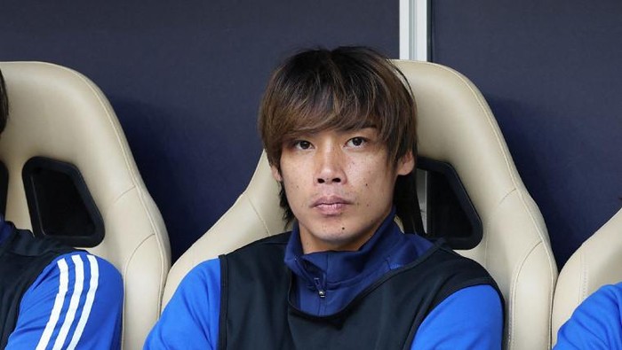 Japans midfielder Junya Ito is seen on the bench before a football match of the Qatar 2023 AFC Asian Cup against Bahrain at al-Thumama Stadium in Doha on January 31, 2024. Japanese police said on February 1 that they have launched an investigation into international footballer Junya Ito after local media reports said two women had accused him of sexual assault, a claim he denies. (Photo by JIJI Press / AFP) / Japan OUT