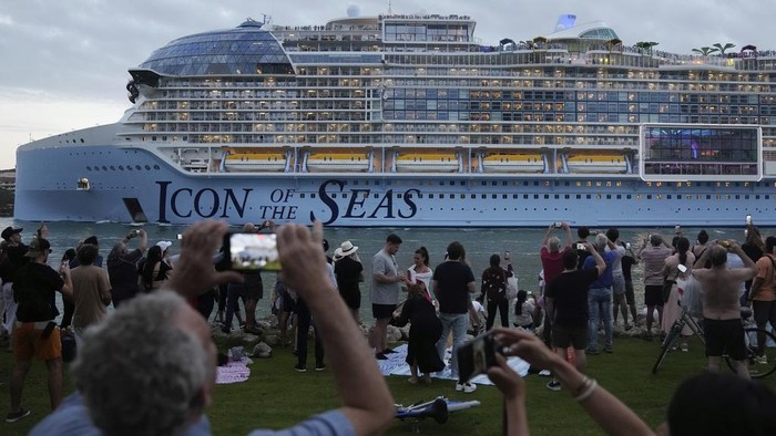 Icon of the Seas, the world's largest cruise ship, sails out of PortMiami for its first public cruise, past Fisher Island and Miami Beach, Fla., Saturday, Jan. 27, 2024. (AP Photo/Rebecca Blackwell)