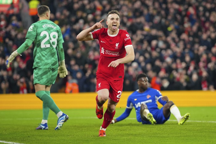 Liverpools Diogo Jota celebrates after scoring his sides first goal during the English Premier League soccer match between Liverpool and Chelsea, at Anfield Stadium, Liverpool, England, Wednesday, Jan.31, 2024. (AP Photo/Jon Super)