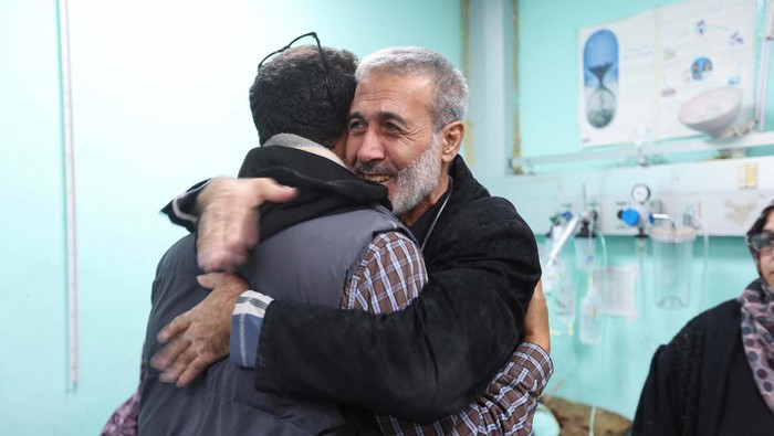 Palestinian doctor Said Abdulrahman Marouf, who was detained by Israel for 45 days and released on Thursday, February 1, embraces a person at Abu Yousef Al-Najjar Hospital in Rafah, in the southern Gaza Strip February 2, 2024. REUTERS/Ibraheem Abu Mustafa