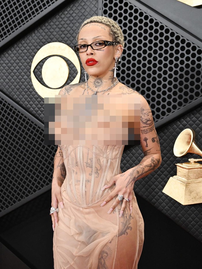 Doja Cat LOS ANGELES, CALIFORNIA - FEBRUARY 04: (EDITORS NOTE: Image contains partial nudity.) Doja Cat attends the 66th GRAMMY Awards at Crypto.com Arena on February 04, 2024 in Los Angeles, California. (Photo by Lester Cohen/Getty Images for The Recording Academy)