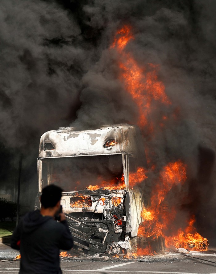 A truck burns,  following the spread of wildfires in Vina del Mar, Chile February 2, 2024. REUTERS/Rodrigo Garrido