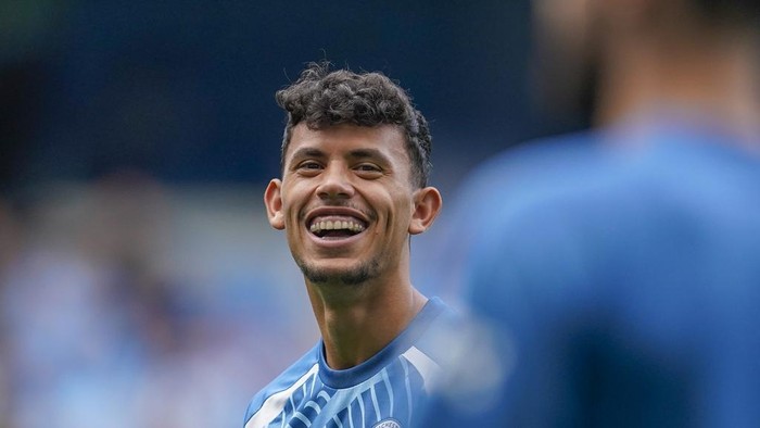 Manchester Citys Matheus Nunes smiles during warm up before the English Premier League soccer match between Manchester City and Fulham at the Etihad stadium in Manchester, England, Saturday, Sept. 2, 2023. (AP Photo/Dave Thompson)