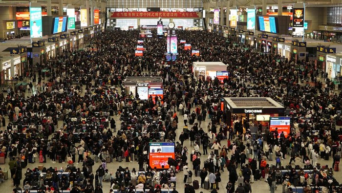 Travellers wait for their trains at Beijing West railway station during the Spring Festival travel rush ahead of the Chinese Lunar New Year, in Beijing, China February 1, 2024. REUTERS/Tingshu Wang