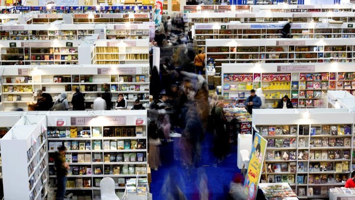 People attend the 55th edition of Cairo International Book Fair, at Egypt's International Exhibition Center, in Cairo, Egypt, February 6, 2024. REUTERS/Mohamed Abd El Ghany