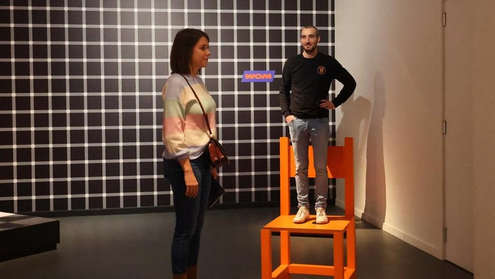 Visitors experiment an illusion called The Beuchet Chair at the World Of Mind WOM museum, dedicated to the five senses, the human perceptions and the illusions in Brussels, Belgium February 6, 2024. REUTERS/Yves Herman