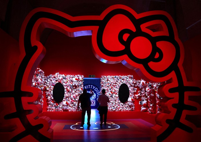 Employees inspect an installation that forms part of Cute, an exhibition which incorporates the Hello Kitty figure, whilst exploring the idea of cuteness in contemporary culture, at Somerset House in London, Britain, February 5, 2024. REUTERS/Toby Melville     TPX IMAGES OF THE DAY