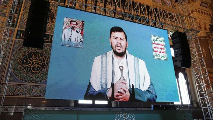 Houthi leader Abdul-Malik al-Houthi addresses followers via a video link at the al-Shaab Mosque, formerly al-Saleh Mosque, in Sanaa, Yemen February 6, 2024. REUTERS/Khaled Abdullah Purchase Licensing Rights