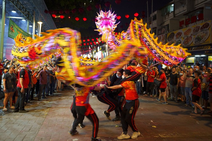 Lion dance performance during the Chinese Hungry Ghost Festival in Kuala Lumpur, Malaysia, late Saturday, Aug. 13, 2022. The Hungry Ghost Festival is celebrated during the seventh month of the Chinese lunar calendar, when prayers are offered to the dead and offerings of food and paper-made models of items such as televisions, refrigerators and sport cars are burnt to appease the wandering spirits. It is believed that the gates of hell are opened during the month and the dead ancestors return to visit their relatives. (AP Photo/Vincent Thian)