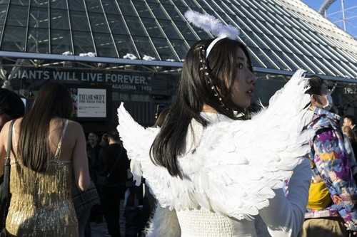 A fan of US singer Taylor Swift, also known as a Swiftie, in wings costume is seen in front of the Tokyo Dome a few hours ahead of the first leg of her Asia-Pacific 