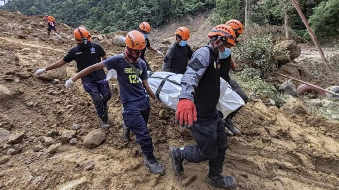 Philippines Landslide In this Feb. 9, 2024 handout photo from Municipality of Monkayo, rescuers recover bodies at the landslide-hit village of Maco in Davao de Oro province, southern Philippines. Several villagers remain missing while some bodies have been recovered from underneath the rubble as rescue efforts continue at the landslide-hit area. (Municipality of Monkayo via AP)