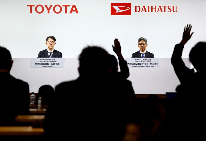 Daihatsu Motor Co.s next President Masahiro Inoue attends a joint press conference with Toyota Motor Corp. President Koji Sato (not in picture) as reporters raise their hands for questions in Tokyo, Japan February 13, 2024.  REUTERS/Issei Kato