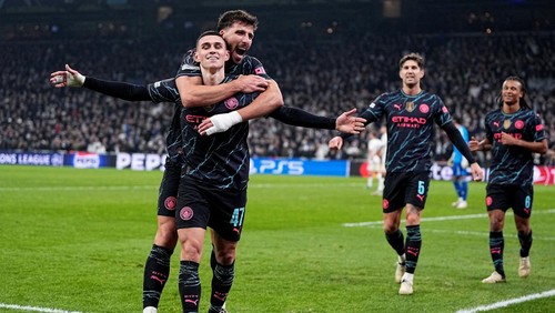 Soccer Football - Champions League - Round of 16 - First Leg - FC Copenhagen v Manchester City - Parken, Copenhagen, Denmark - February 13, 2024 Manchester Citys Phil Foden celebrates scoring their third goal with Ruben Dias Mads Claus Rasmussen/Ritzau Scanpix via REUTERS      ATTENTION EDITORS - THIS IMAGE WAS PROVIDED BY A THIRD PARTY. DENMARK OUT. NO COMMERCIAL OR EDITORIAL SALES IN DENMARK.