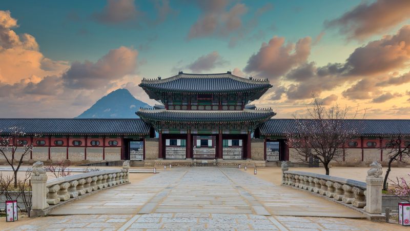 Seoul, South Korea - Aug 8, 2013: Korean Royal guards perform the changing of the guard ceremony at Gwanghwamun, Gyeongbokgung Palace, Seoul, South Korea. The ceremony started in the 14th century and has been well preserved and is now shown to the tourists several times a day.
