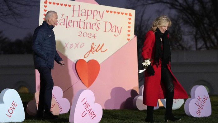 President Joe Biden and first lady Jill Biden look at Valentine's Day decorations on the North Lawn of the White House in Washington, Wednesday, Feb. 14, 2024. (AP Photo/Mark Schiefelbein)