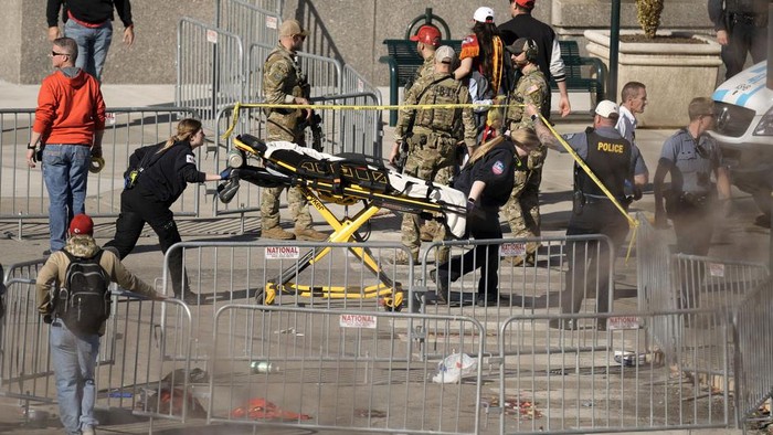 Emergency crew arrive at the scene after an incident following the Kansas City Chiefs victory parade in Kansas City, Mo., Wednesday, Feb. 14, 2024. The Chiefs defeated the San Francisco 49ers Sunday in the NFL Super Bowl 58 football game. (AP Photo/Charlie Riedel)