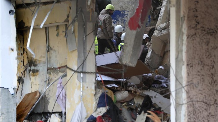 Civil defence and rescue workers remove rubbles from a building that was attacked Wednesday night by an Israeli airstrike, in Nabatiyeh town, south Lebanon, Thursday, Feb. 15, 2024. The airstrike killed and injured several people and child, Lebanon's state news agency reported. (AP Photo/Mohammed Zaatari)