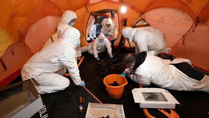 Archaeologists dig for human remains at a peat bog site in Bellaghy, Northern Ireland, in this undated handout image released January 25, 2024. Police Service of Northern Ireland/Handout via REUTERS THIS IMAGE HAS BEEN SUPPLIED BY A THIRD PARTY. NO RESALES. NO ARCHIVES. MANDATORY CREDIT
