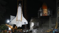 Space Shuttle Endeavour is lifted into the site of the future Samuel Oschin Air and Space Center on Monday, Jan. 29, 2024, in Los Angeles. (AP Photo/Ashley Landis)