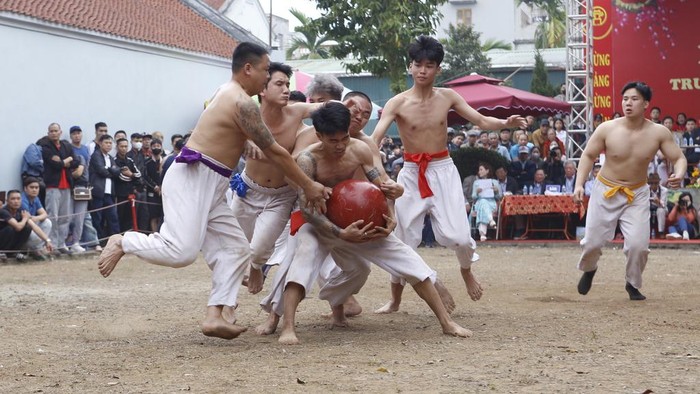 Villagers attend a traditional 