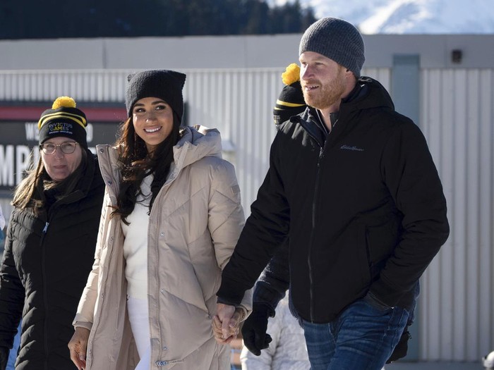 Britains Prince Harry and Meghan, the Duke and Duchess of Sussex, attend the Invictus Games training camp in Whistler, British Columbia, on Wednesday, Feb. 14, 2024. (Ethan Cairns/The Canadian Press via AP)