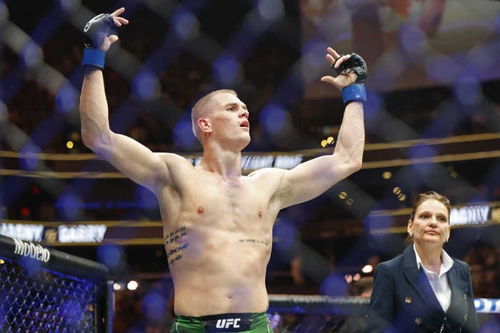 Ian Garry celebrates after defeating Neil Magny during a UFC 292 mixed martial arts fight, Saturday, August 19, 2023, in Boston. Garry won via unanimous decision. (AP Photo/Gregory Payan)