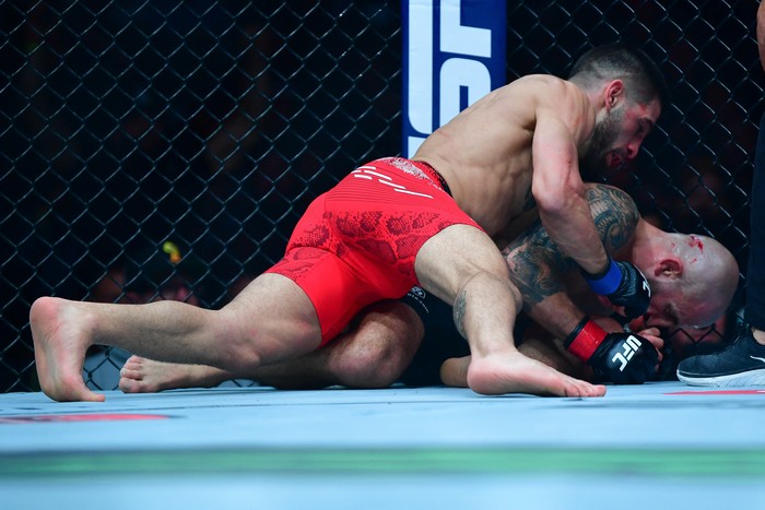 Feb 17, 2024; Anaheim, California, USA; Ilia Topuria lands hits against Alexander Volkanovski for his KO victory during UFC 298 at Honda Center. Mandatory Credit: Gary A. Vasquez-USA TODAY Sports